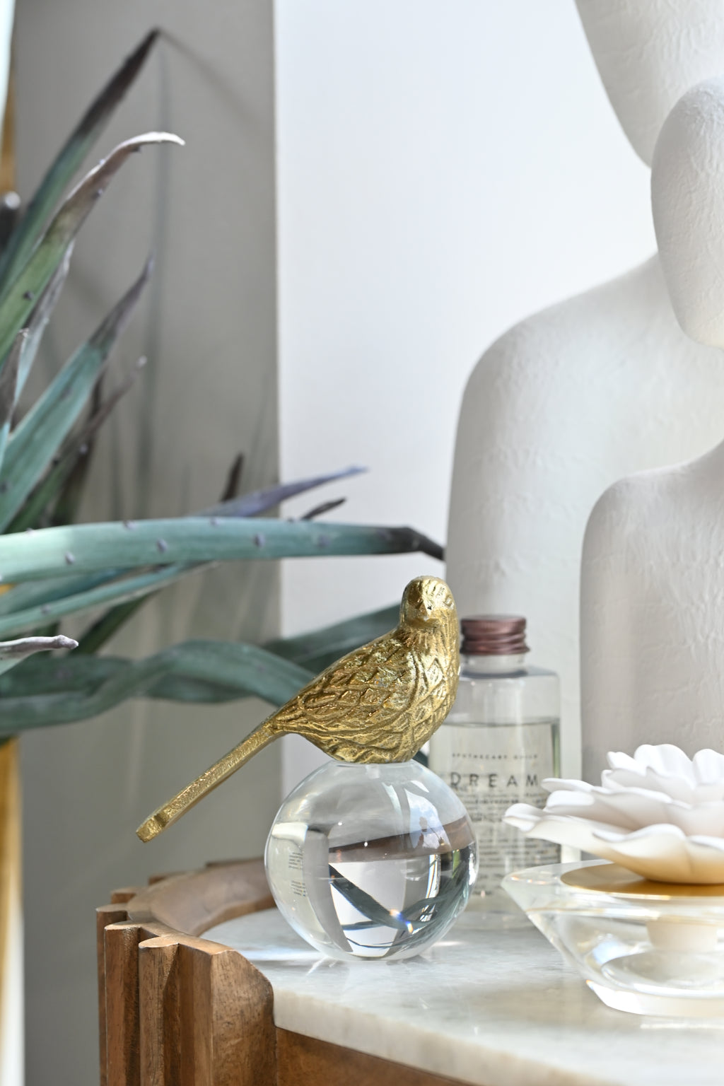 Gold bird perched
