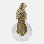 Gold bird perched