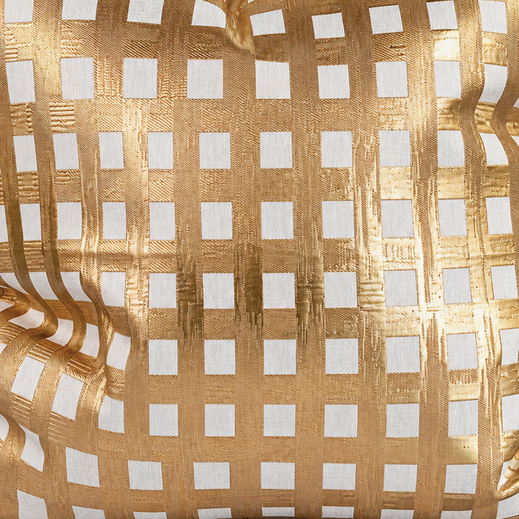 Close-up of Paloma pillow’s textured gold grid and ivory squares.